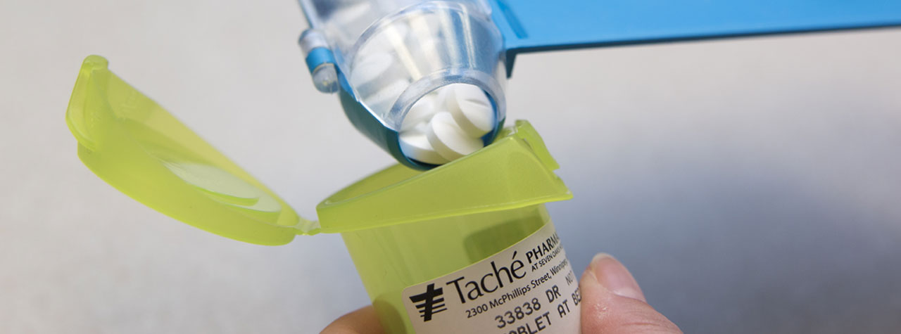 pills being poured into a bottle